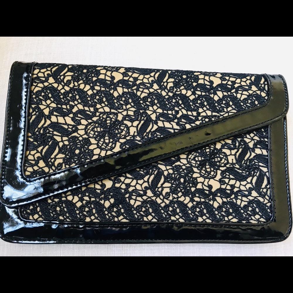 Lace with patent leather piping clutch